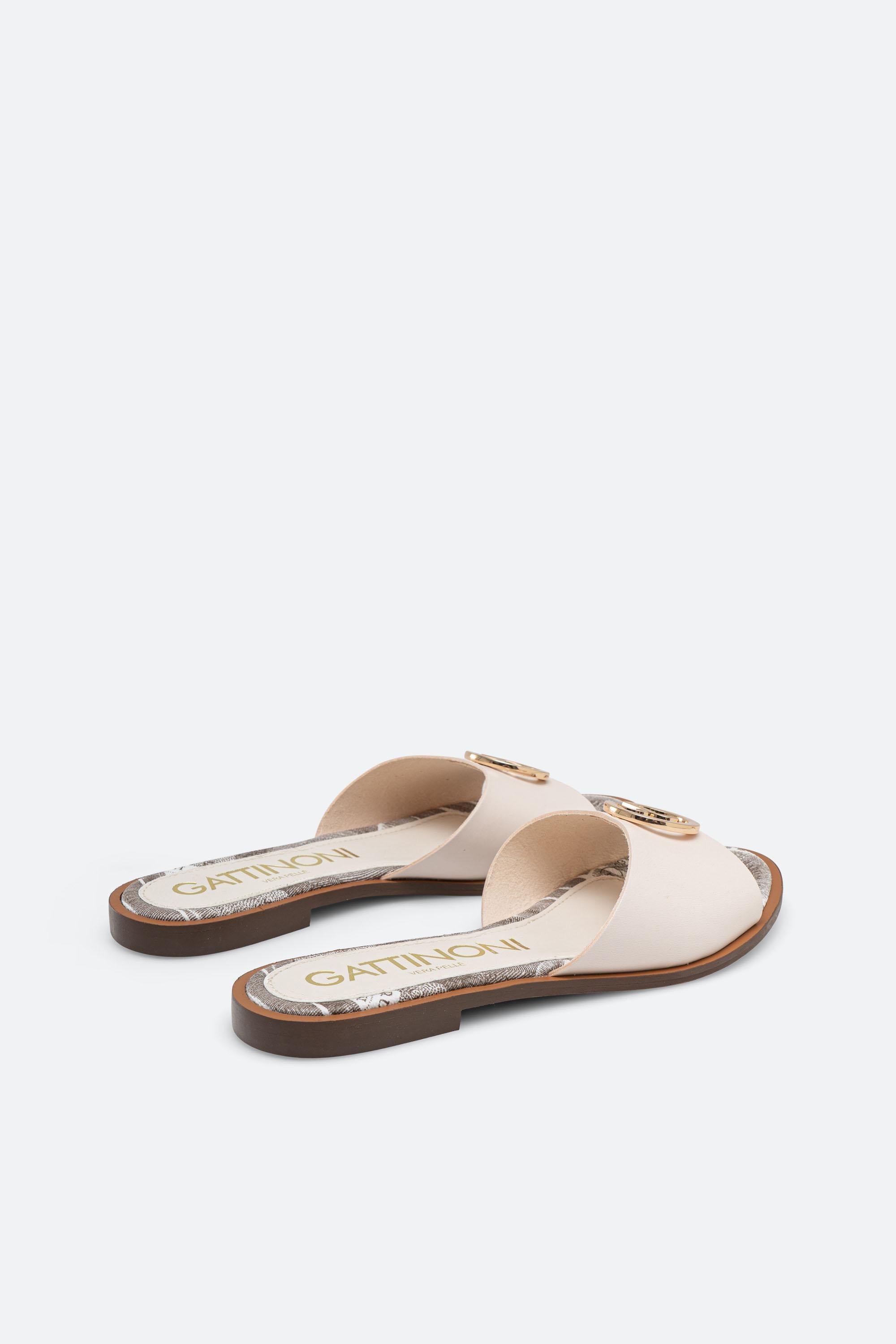 White leather slipper with plaque detail