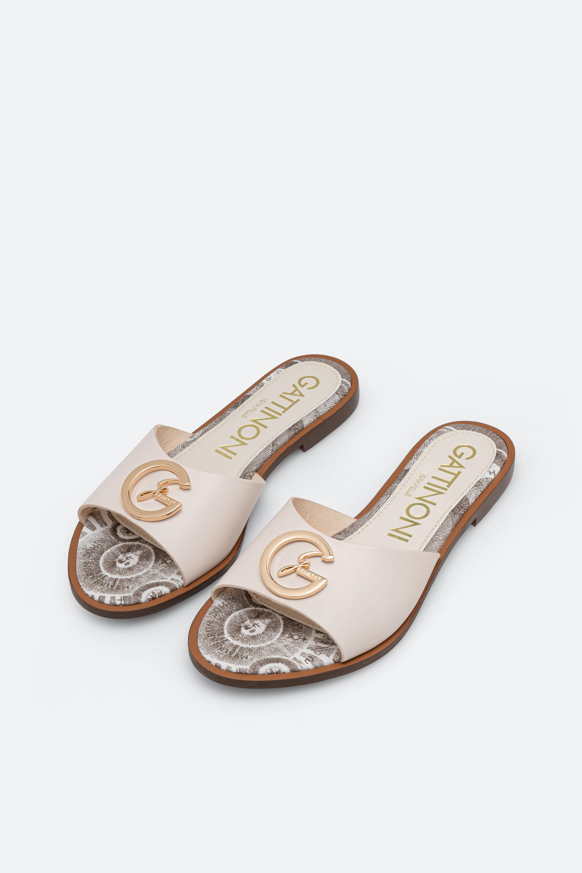 White leather slipper with plaque detail