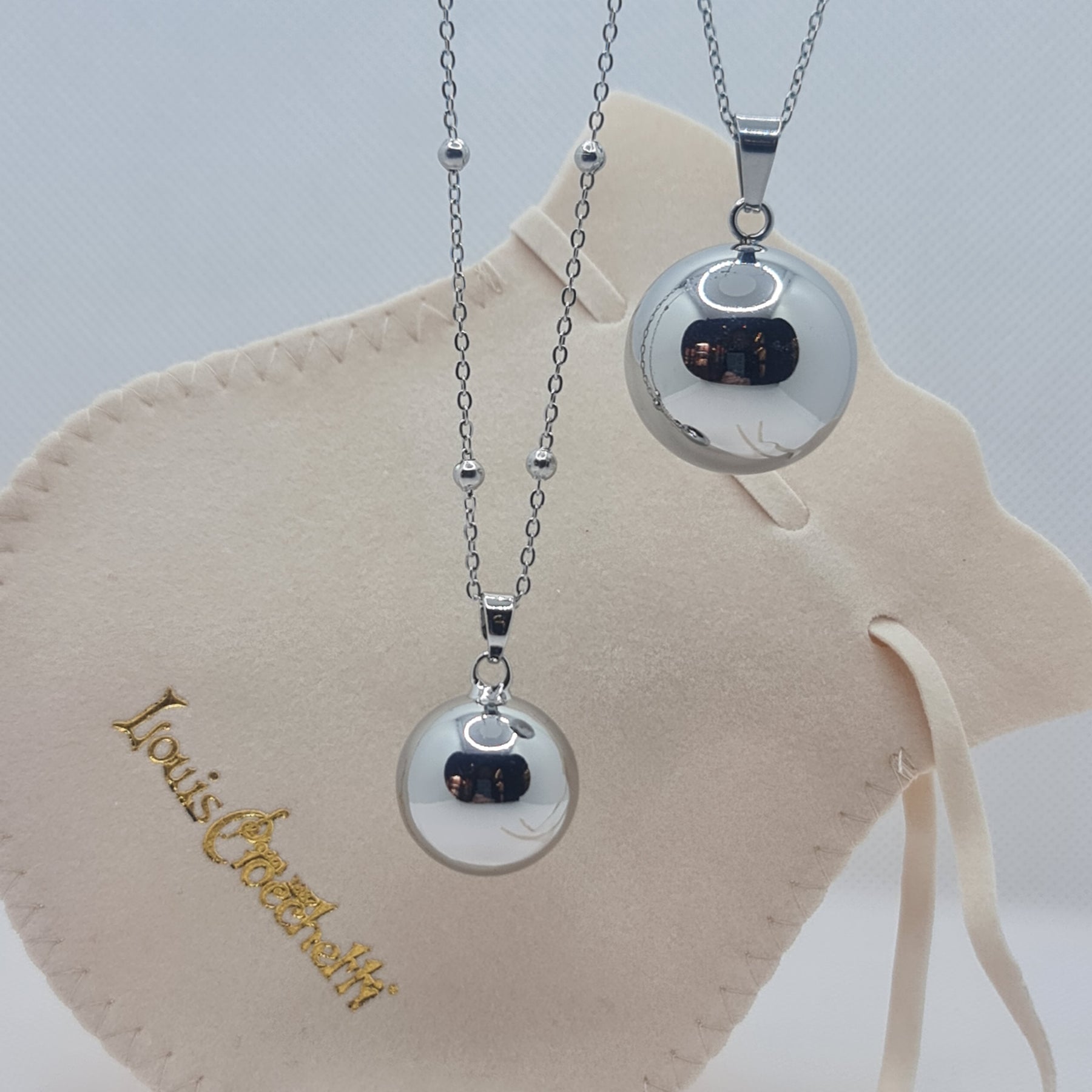 Angel caller necklace in steel 100 cm with mirror polished sphere with rattle 2 cm