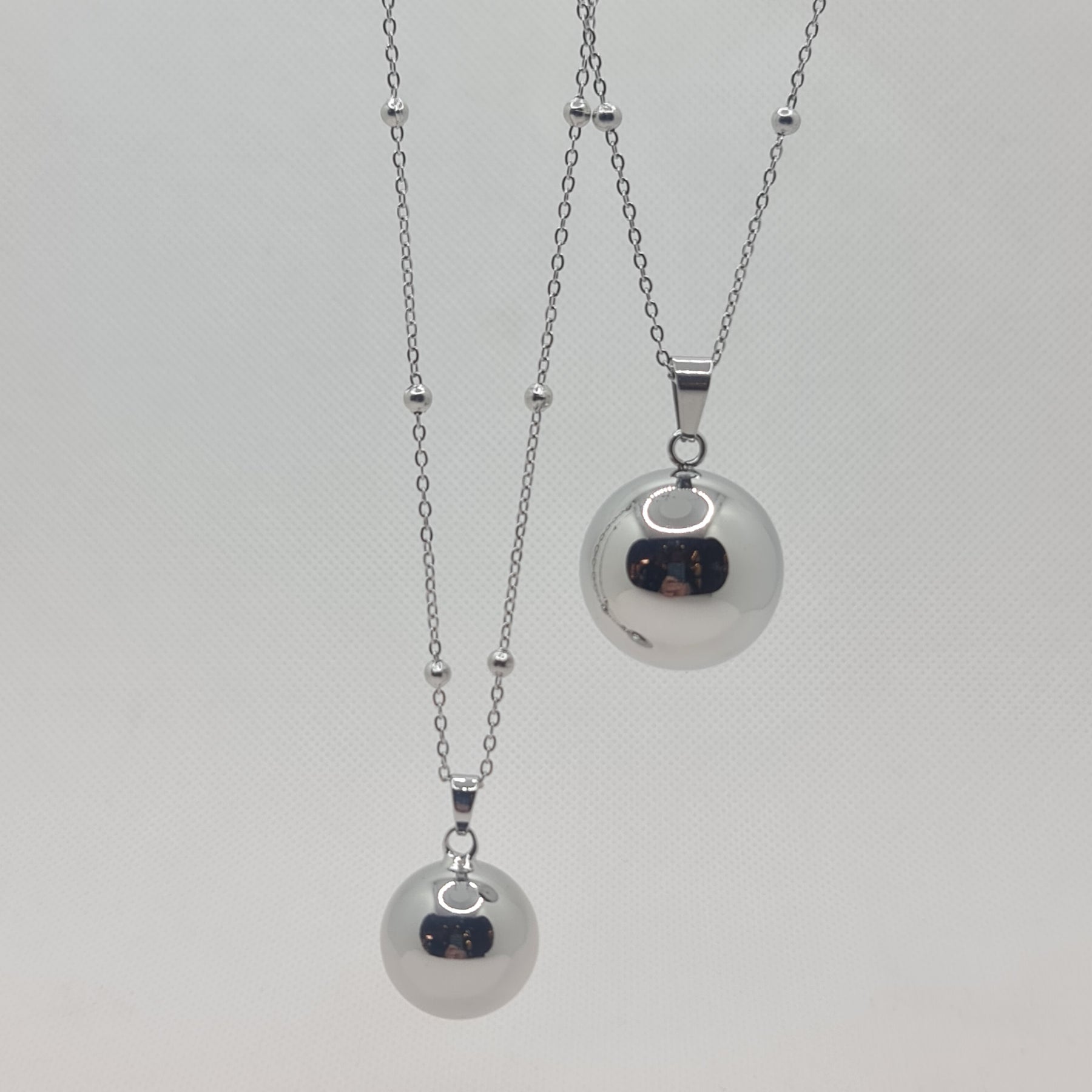 Angel caller necklace in steel 90 cm with mirror polished bell sphere 2.5 cm