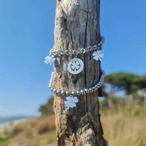 Bracelet in steel with shiny spheres and central pendant tree of life cut-out