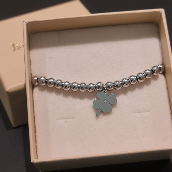Bracelet steel shiny spheres and central clover pendant