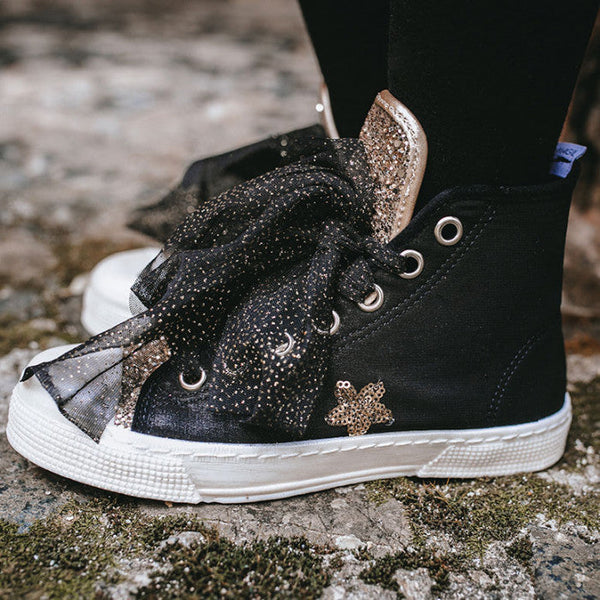 HAUT NOIR AVEC ÉTOILES ET GLITTER D'OR