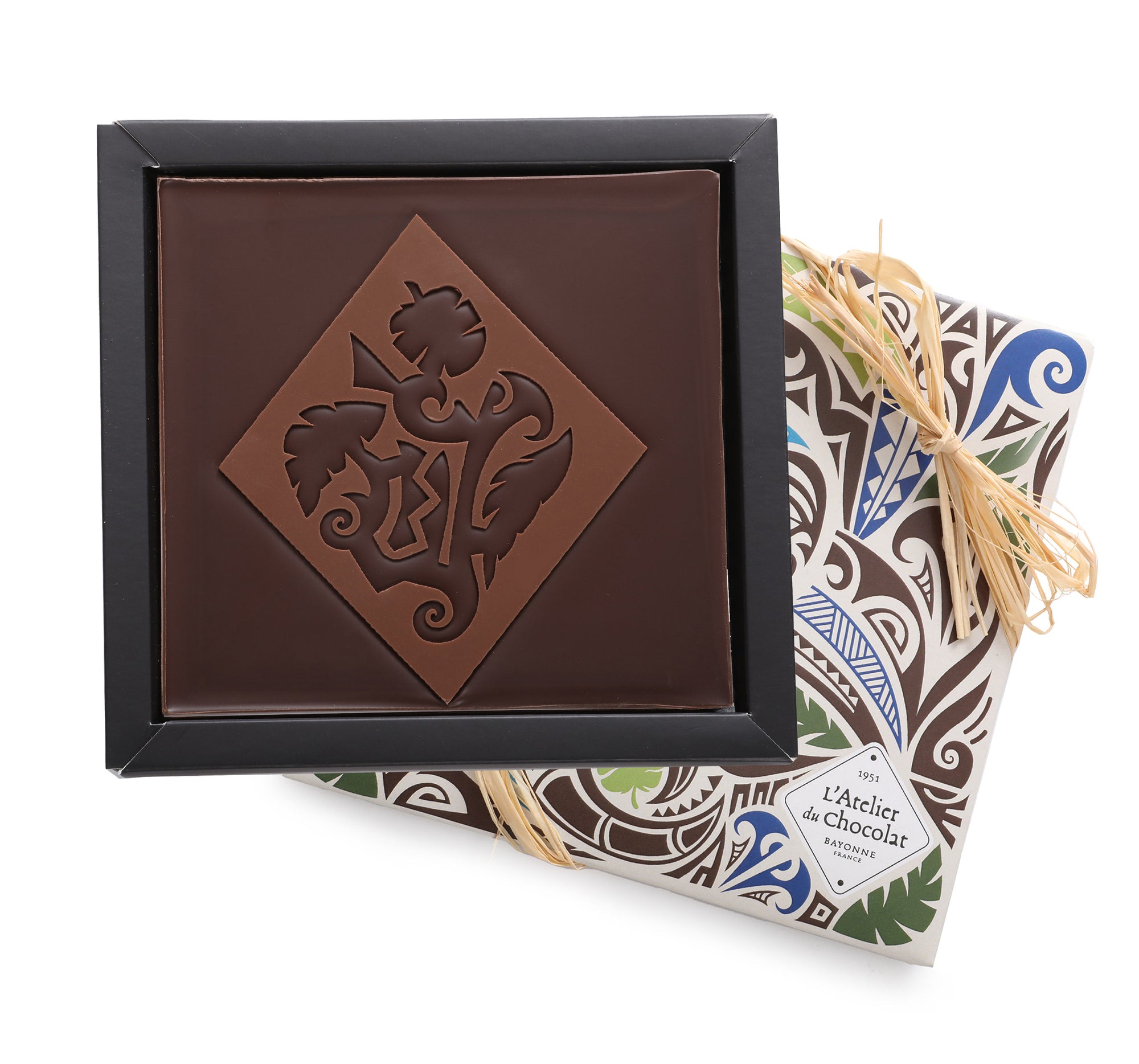 Dark chocolate square with Maori patterns