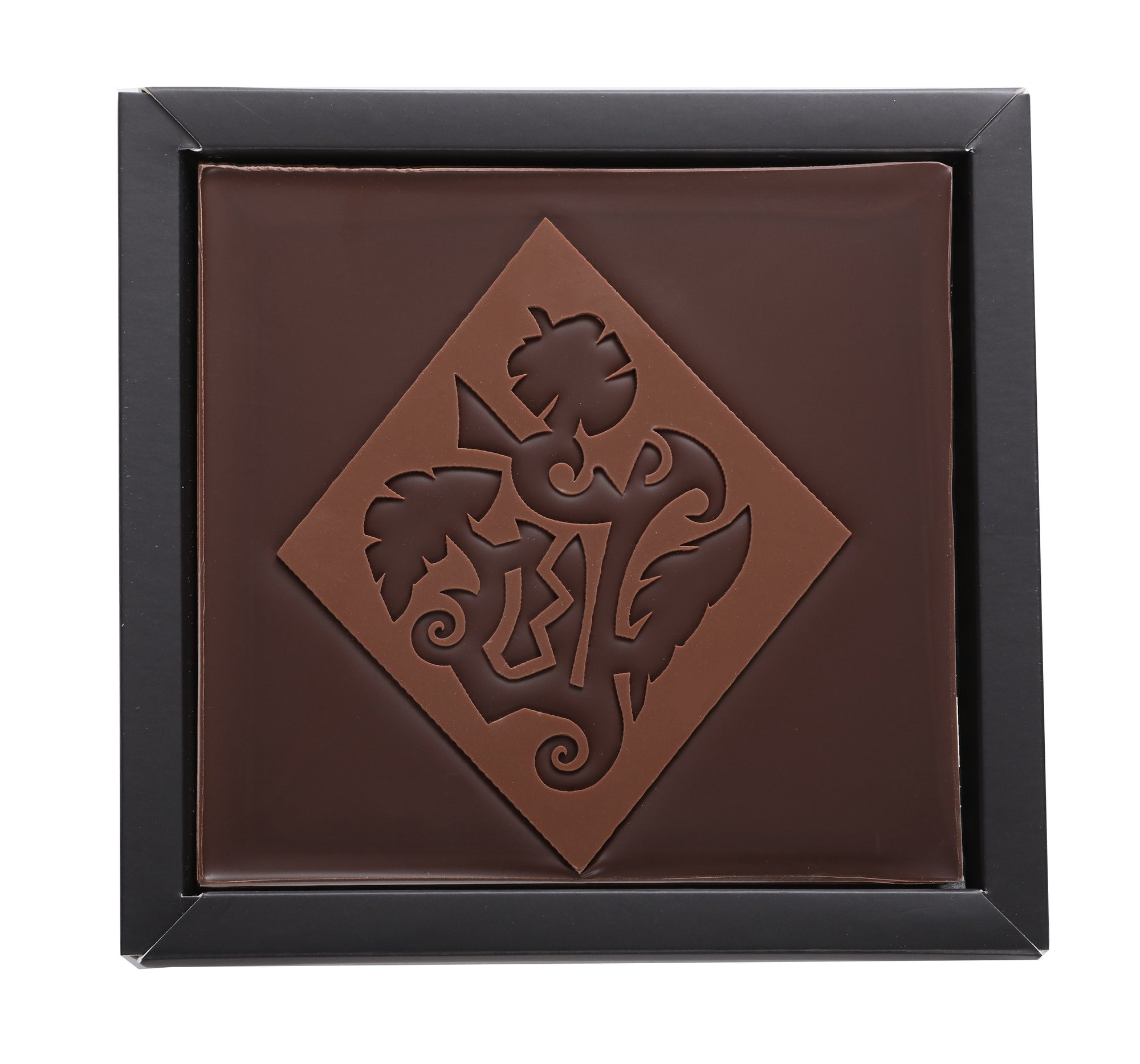 Dark chocolate square with Maori patterns