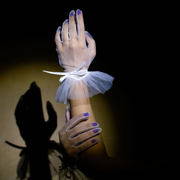 Social textile gloves with a bow