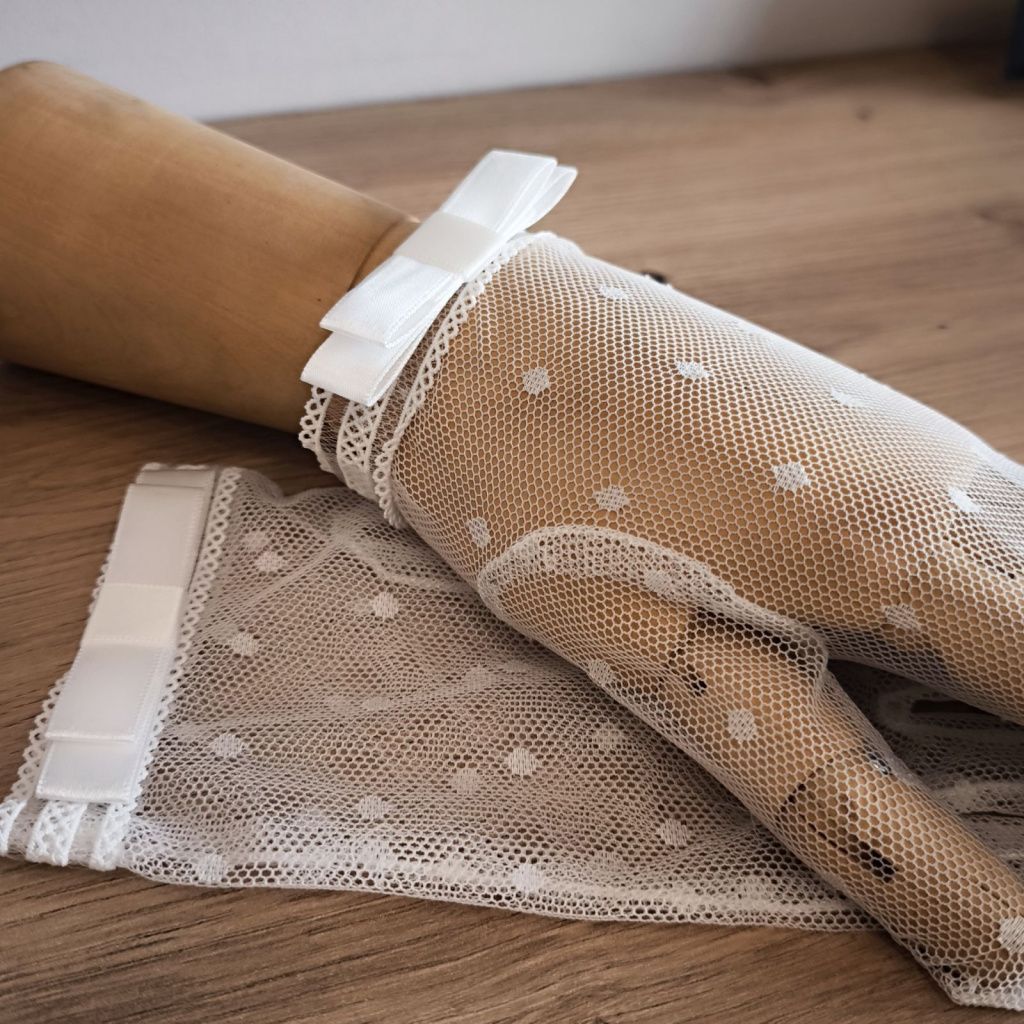Social textile gloves with a bow