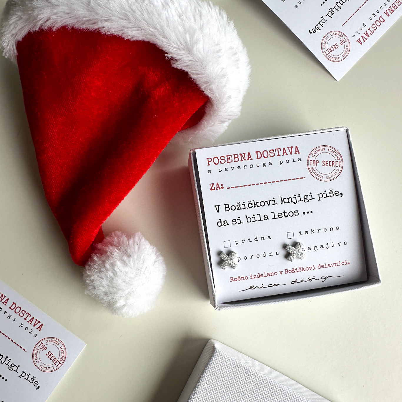 Earrings XX on a festive card for the good or naughty