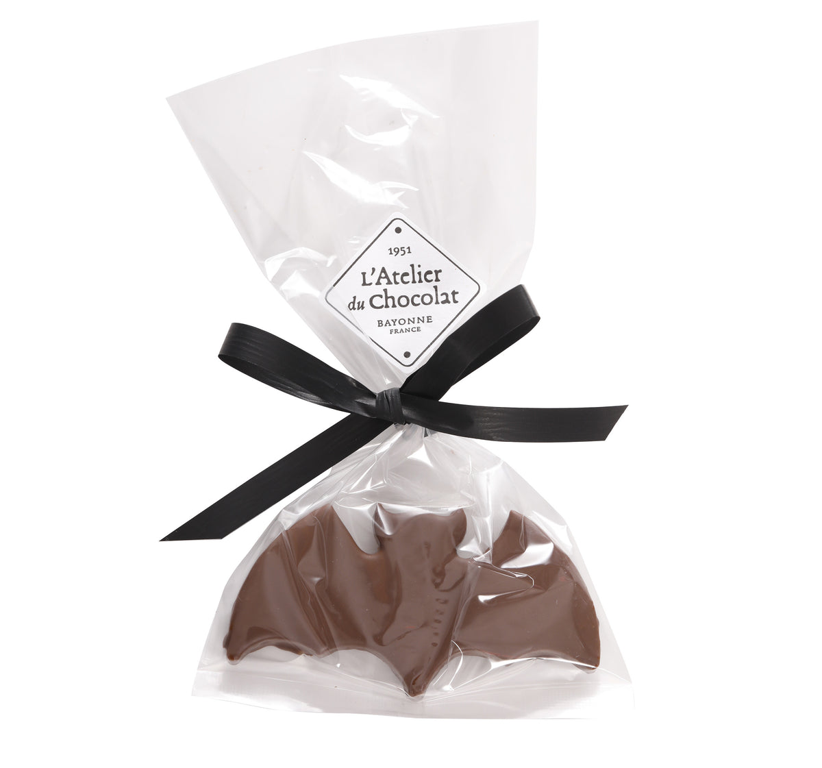 Trattamento di Halloween con pralina di cioccolato al latte frizzante a forma di pipistrello