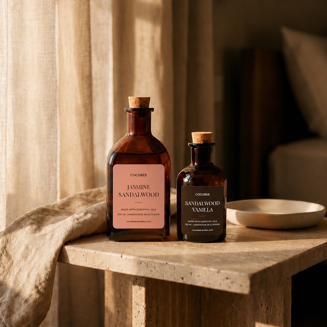 Jasmine Sandalwood and Sandalwood Vanilla CocoBee reed diffusers beside linen