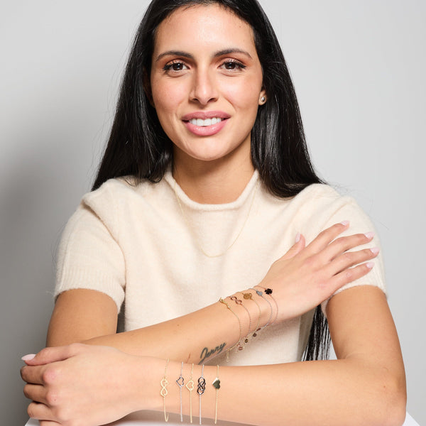 Gold-plated silver bracelet with intertwined and perforated infinity center and heart