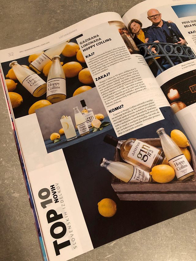 Odprta revija s predstavitvijo limonade Hoppy Collins in fotografijami izdelka.
