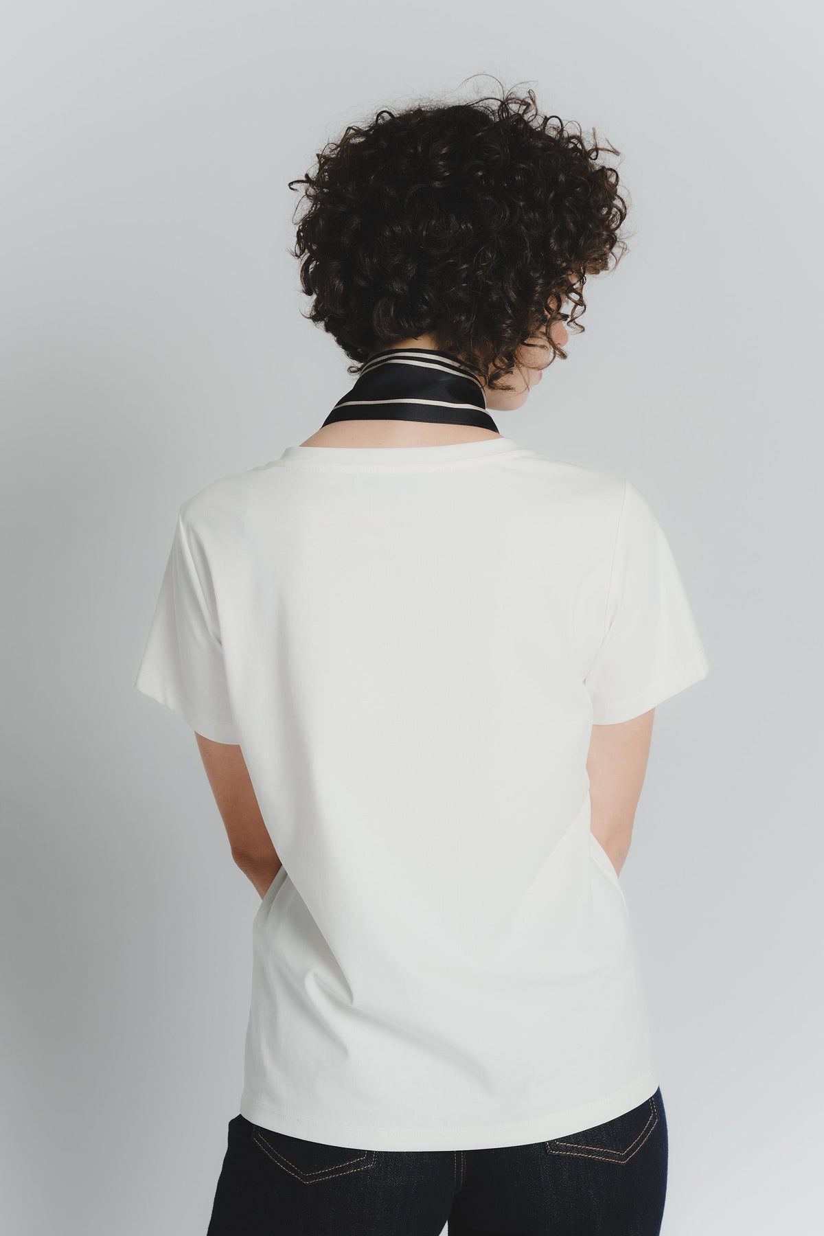 White T-shirt with Black and Beige Check Scarf