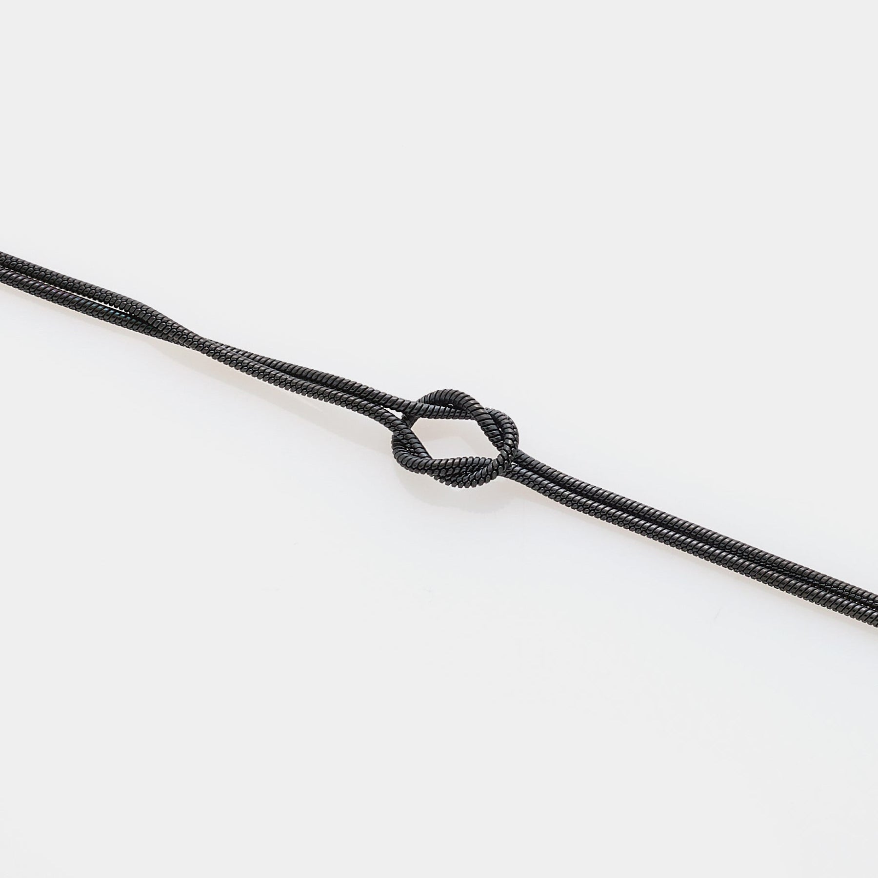 Soft infinity knot bracelet in steel