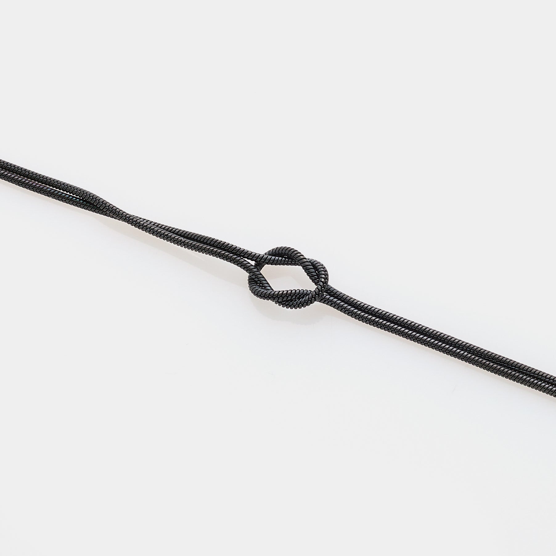 Soft infinity knot bracelet in steel