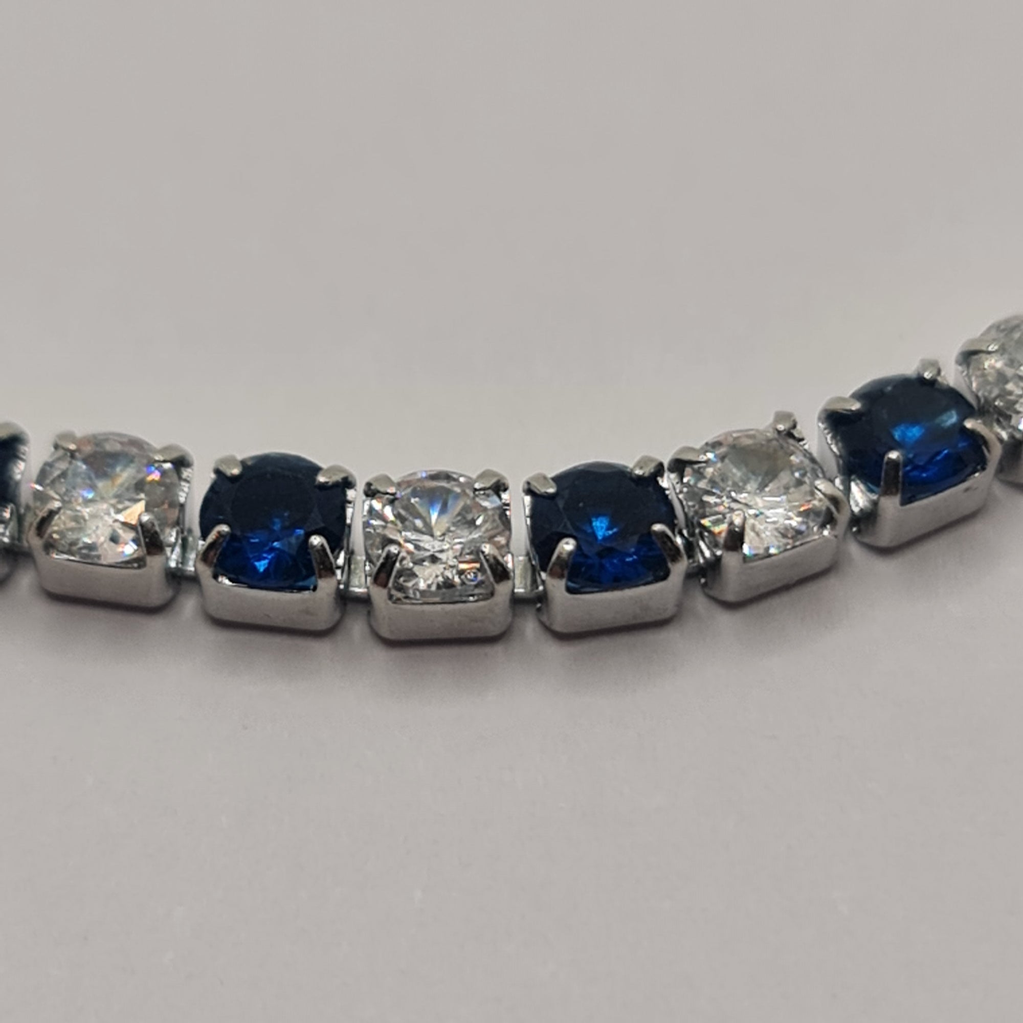 BRACCIALE ACCIAIO TENNIS E ZIRCONI BIANCHI E BLU MM 3,00 CHIUSURA A SCORRERE