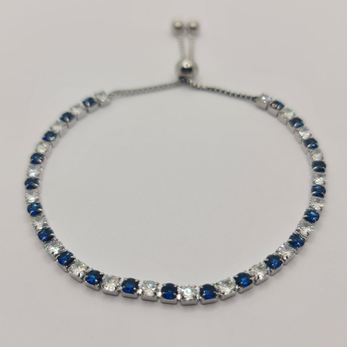 STEEL TENNIS BRACELET WITH WHITE AND BLUE ZIRCONIA 3.00 MM SLIDING CLOSURE