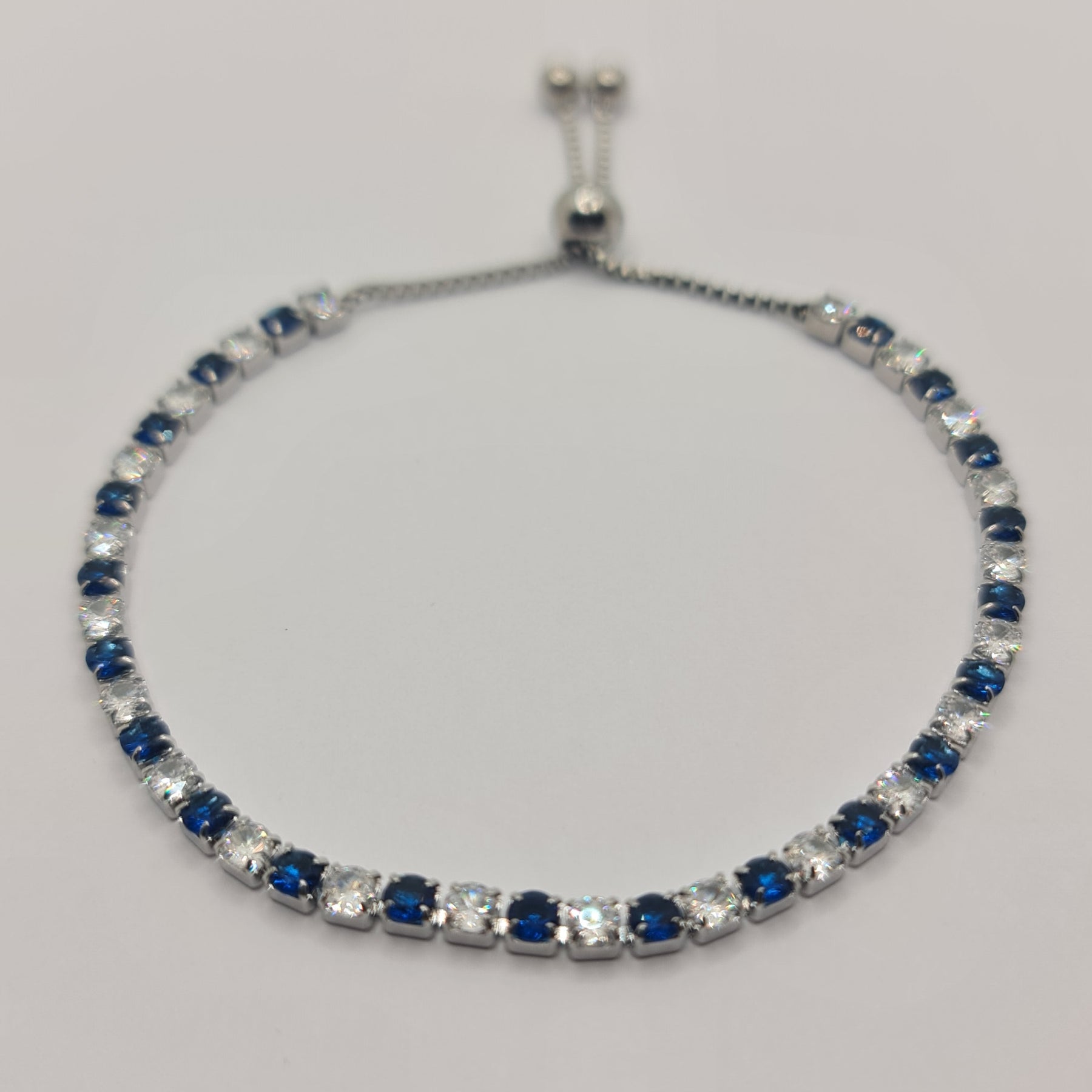 BRACCIALE ACCIAIO TENNIS E ZIRCONI BIANCHI E BLU MM 3,00 CHIUSURA A SCORRERE
