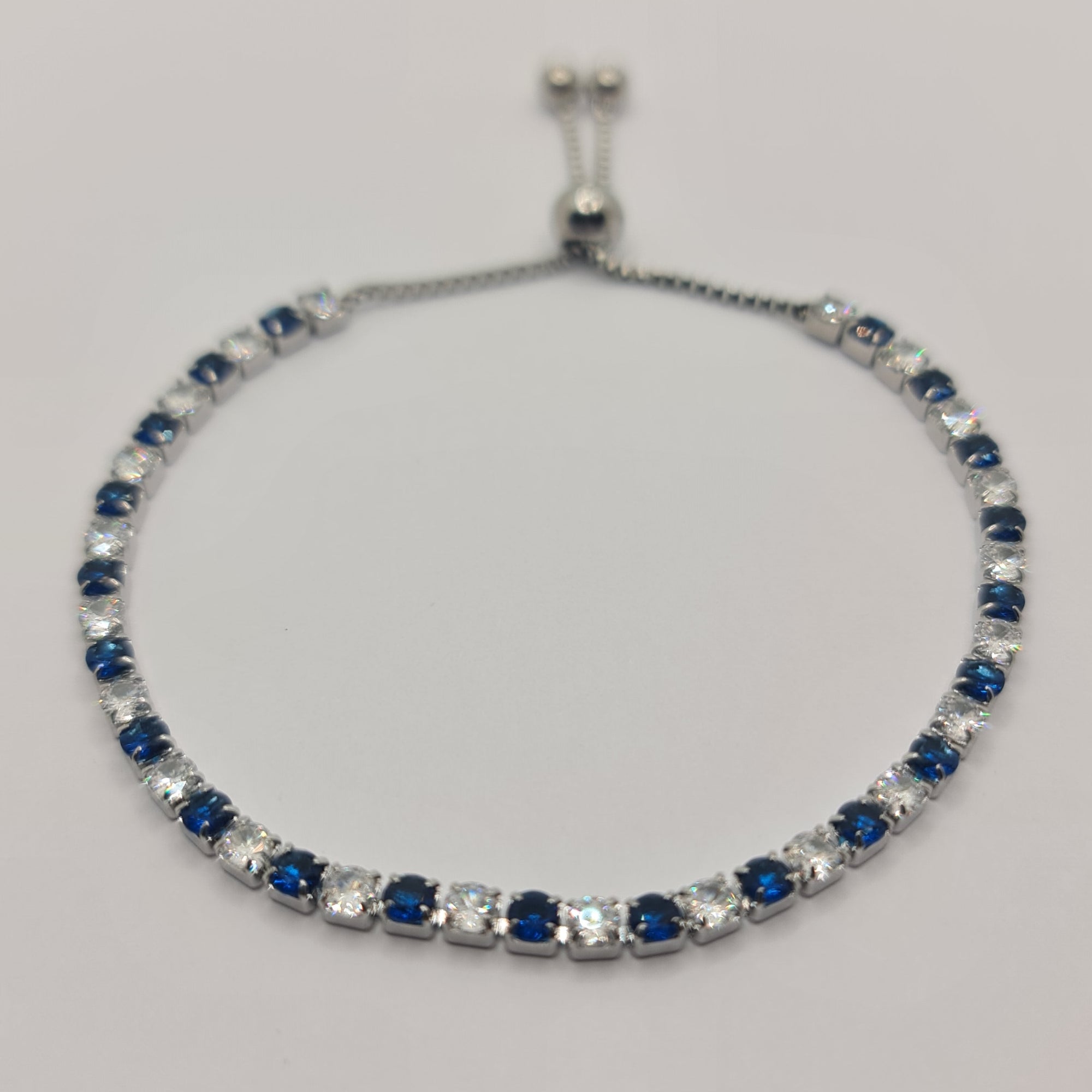 BRACCIALE ACCIAIO TENNIS E ZIRCONI BIANCHI E BLU MM 3,00 CHIUSURA A SCORRERE