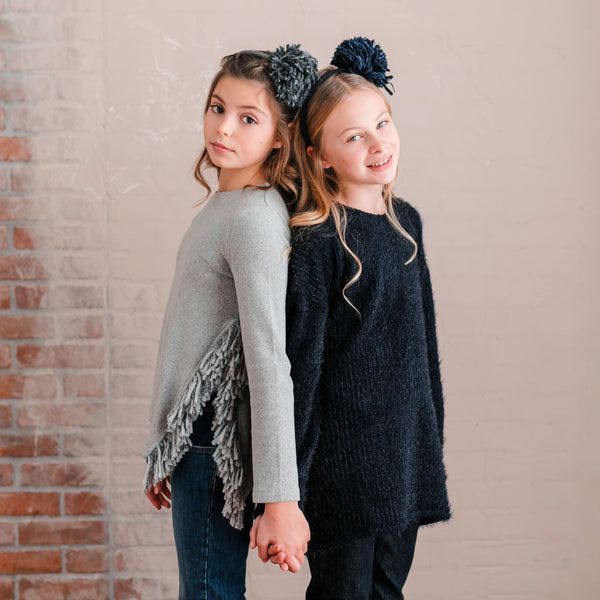 SWEATER WITH SIDE SLIT DETAIL AND FRINGE