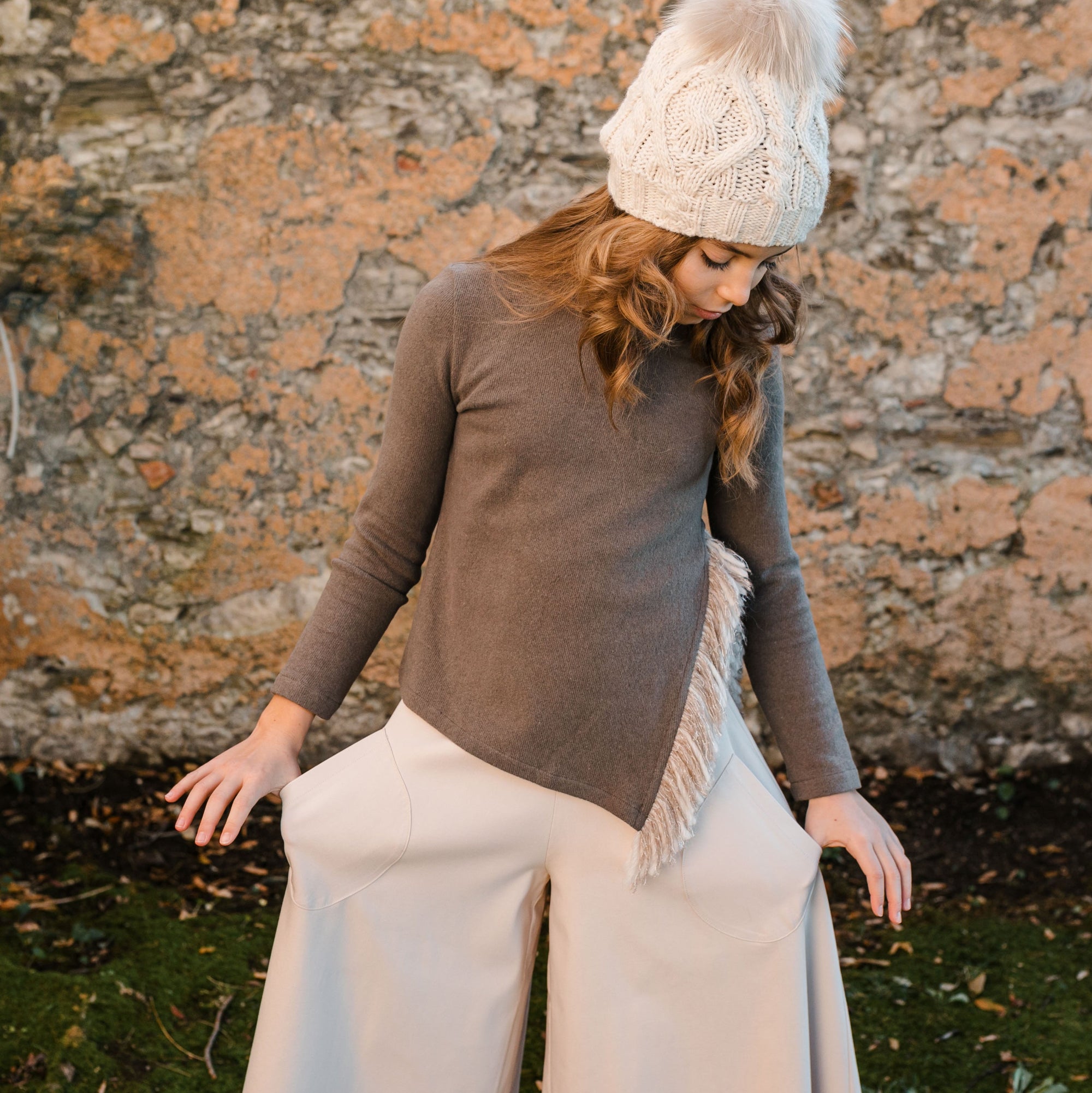 SWEATER WITH SIDE SLIT DETAIL AND FRINGE