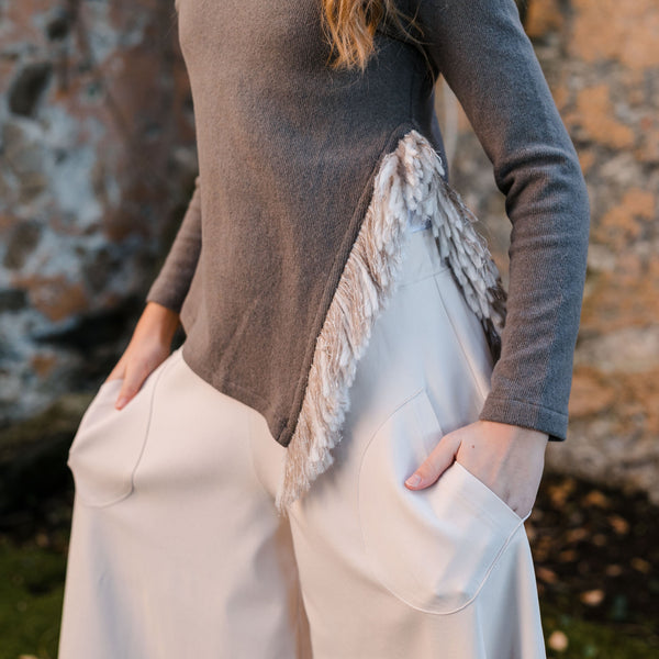 SWEATER WITH SIDE SLIT DETAIL AND FRINGE