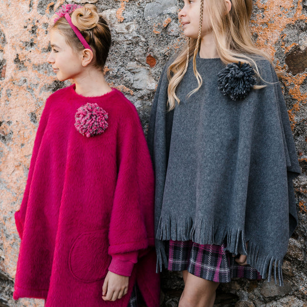 FLEECE CAPE WITH FRINGES