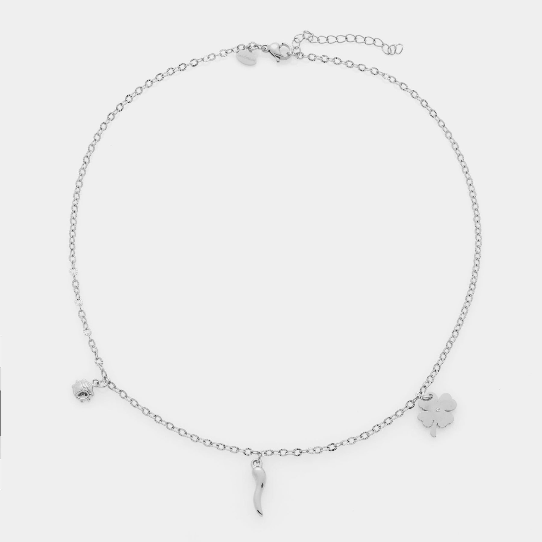 Collana acciaio maglia rolò fina con tre ciondoli in acciaio quadrifoglio, corno e coccinella