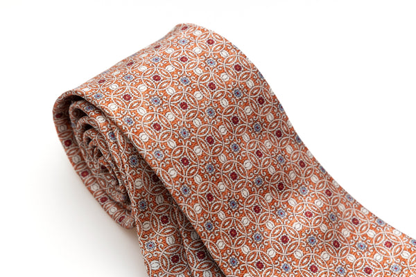 Orange tie with geometric pattern in pure silk