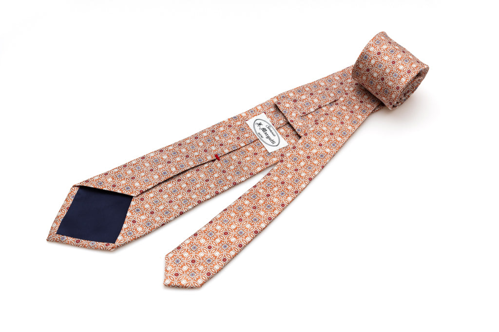 Orange tie with geometric pattern in pure silk