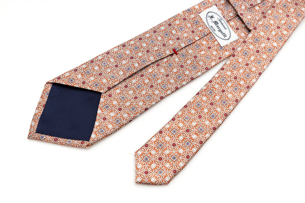 Orange tie with geometric pattern in pure silk