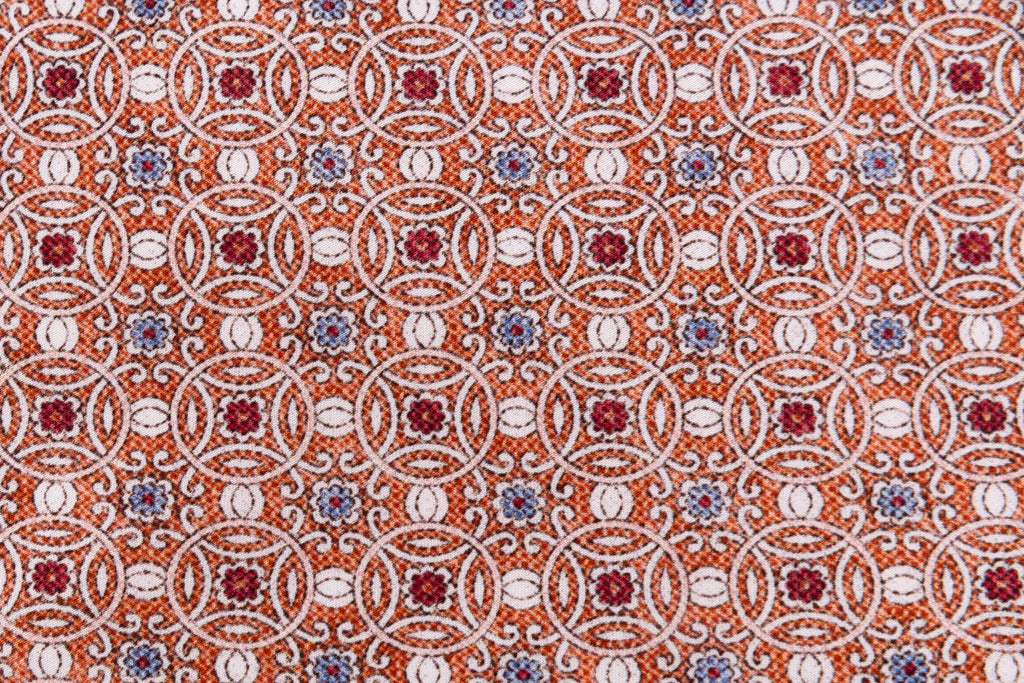 Orange tie with geometric pattern in pure silk