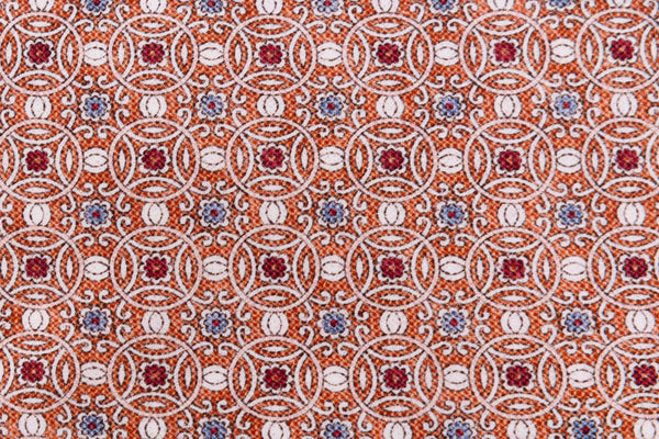 Orange tie with geometric pattern in pure silk