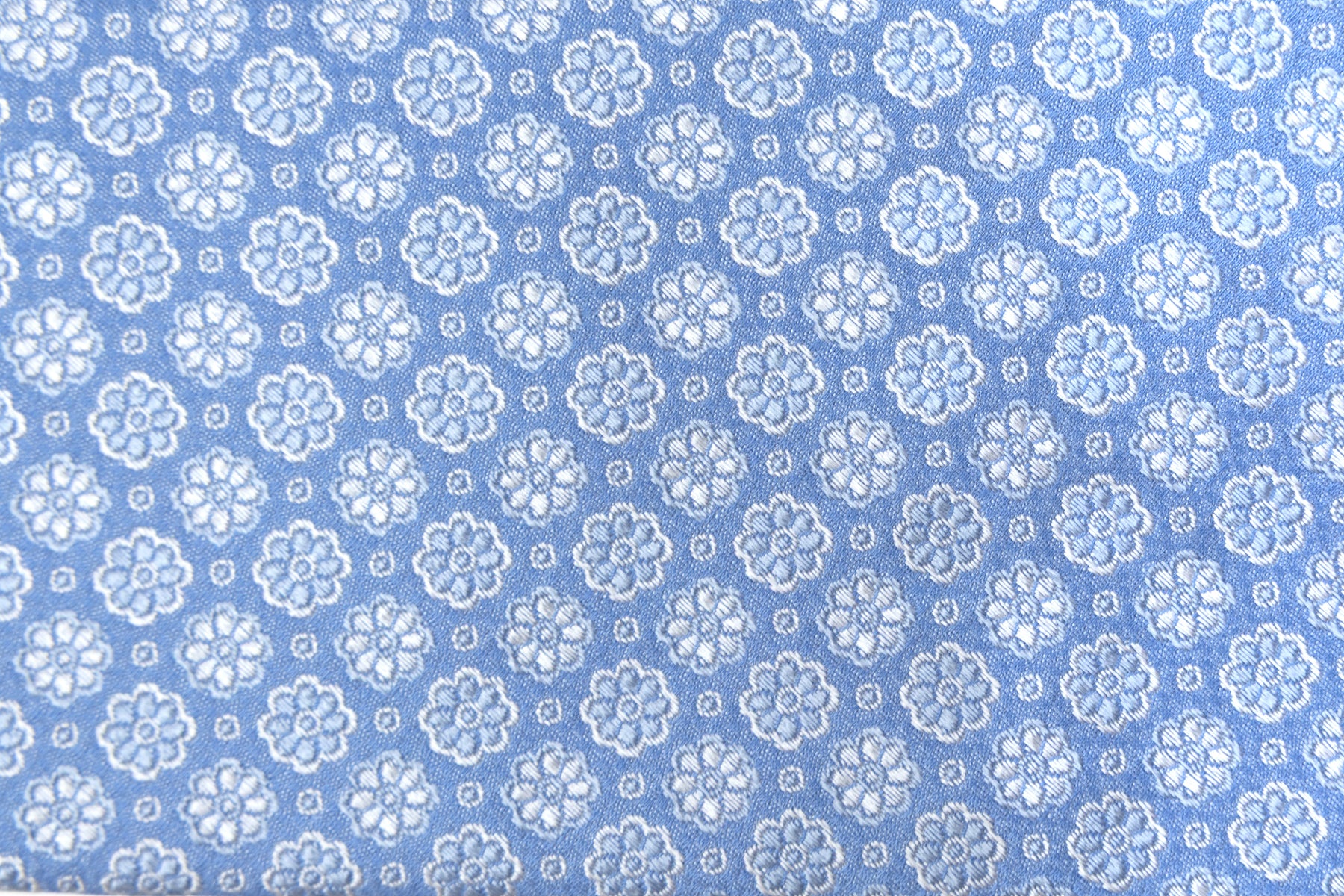 Light blue tie with embroidered flowers pure silk