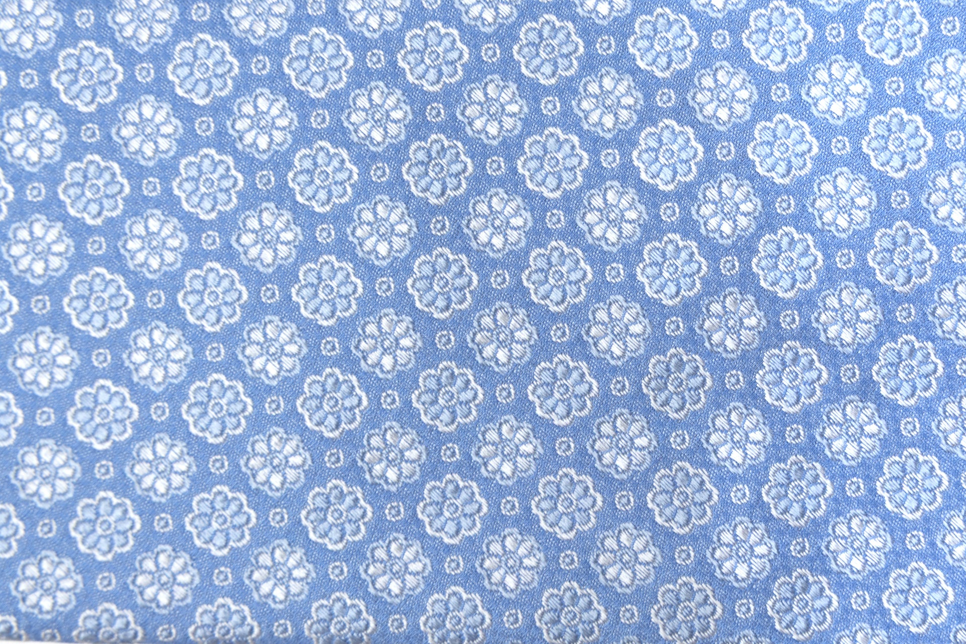 Light blue tie with embroidered flowers pure silk