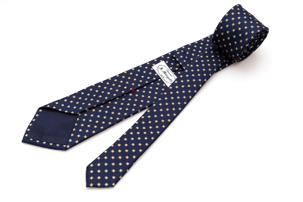 Blue tie with beige geometry in pure silk