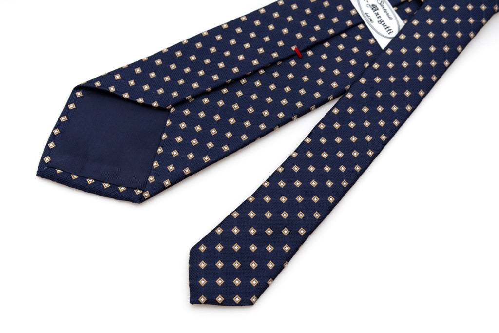Cravatta blu con geometria beige in pura seta