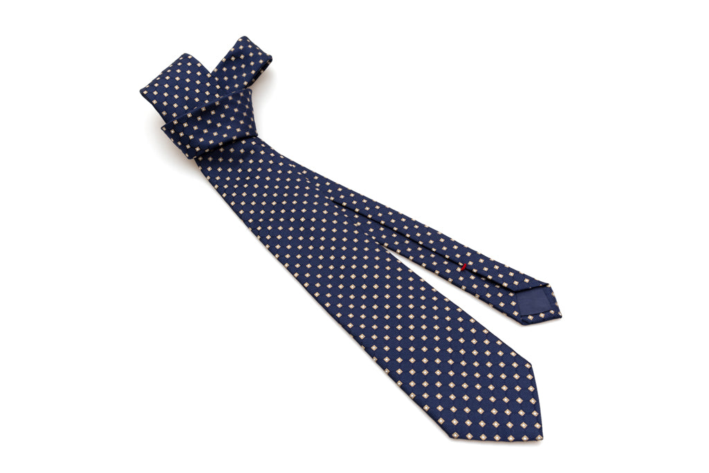 Blue tie with beige geometry in pure silk