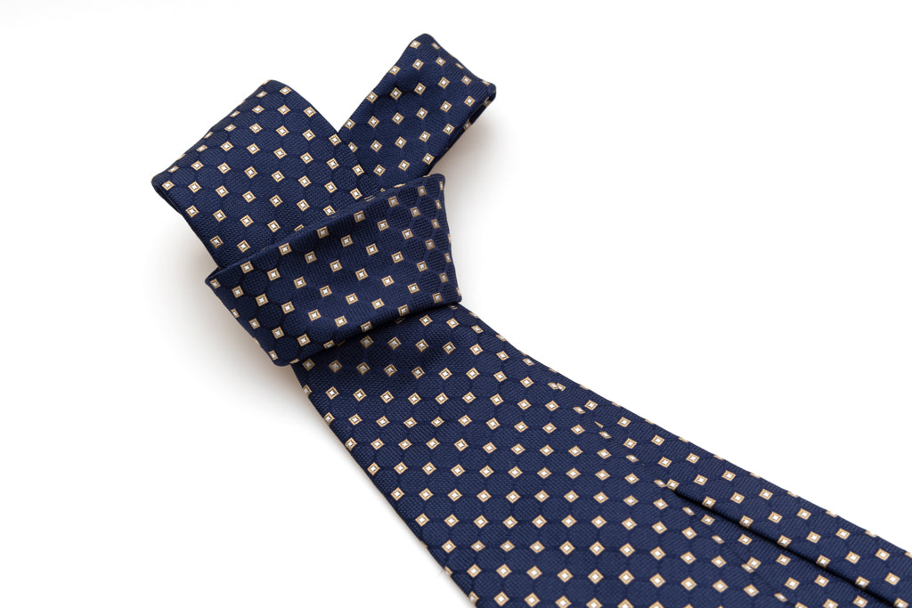 Blue tie with beige geometry in pure silk