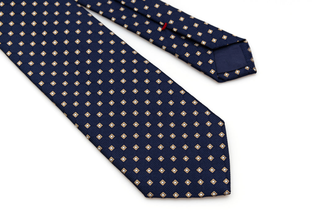 Blue tie with beige geometry in pure silk
