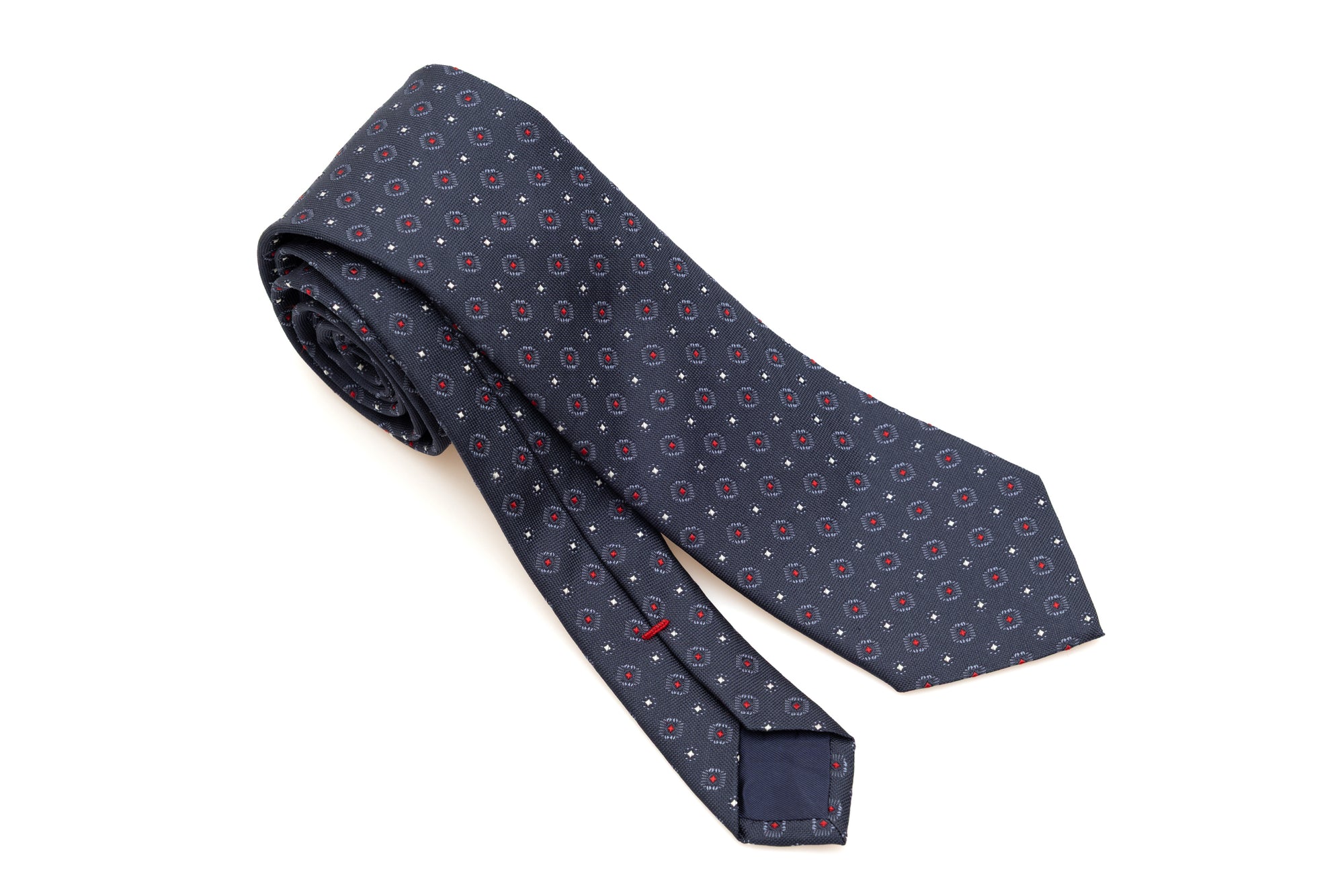 Cravate bleue avec motif rouge en pure soie