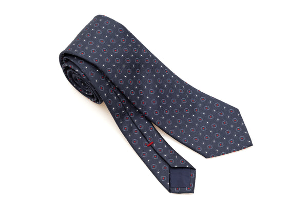 Cravate bleue avec motif rouge en pure soie