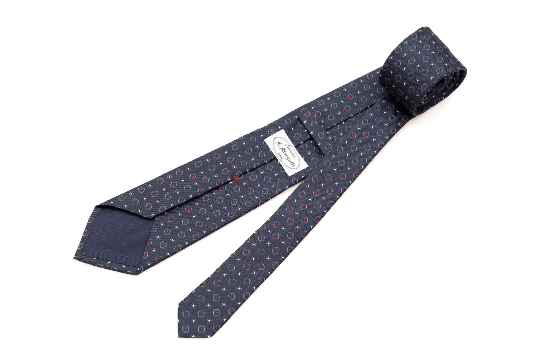 Cravate bleue avec motif rouge en pure soie
