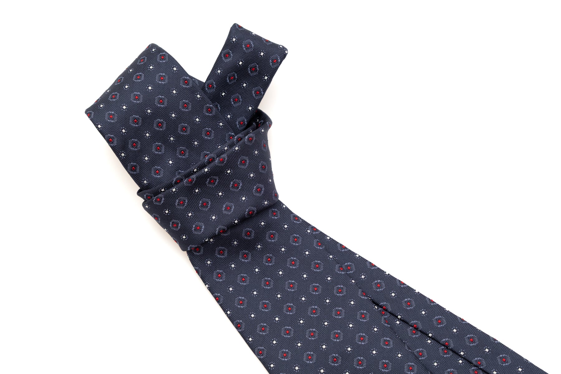 Cravate bleue avec motif rouge en pure soie
