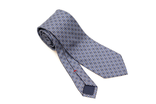 Corbata azul de patrón geométrico ligero en seda pura