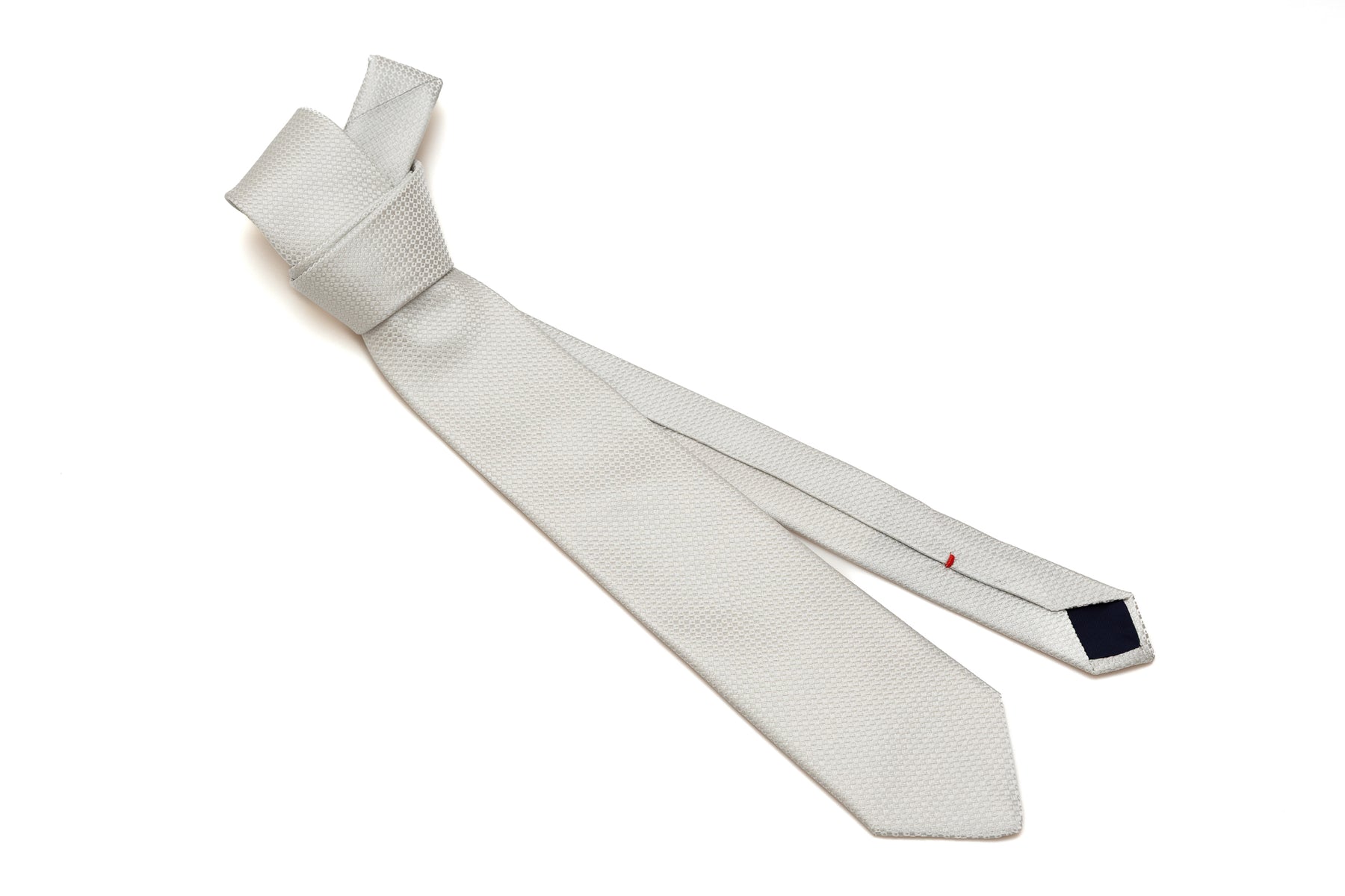 Embroidered pearl gray tie in pure silk