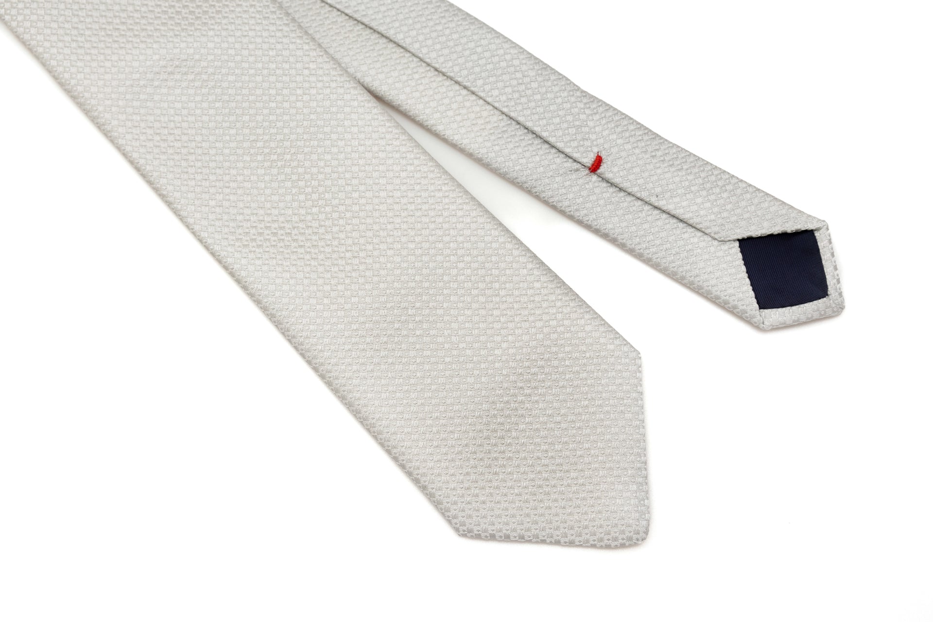 Embroidered pearl gray tie in pure silk