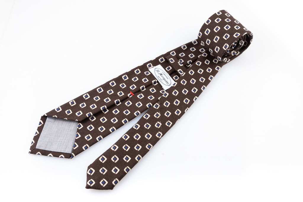 Brown tie with geometric pattern in pure wool