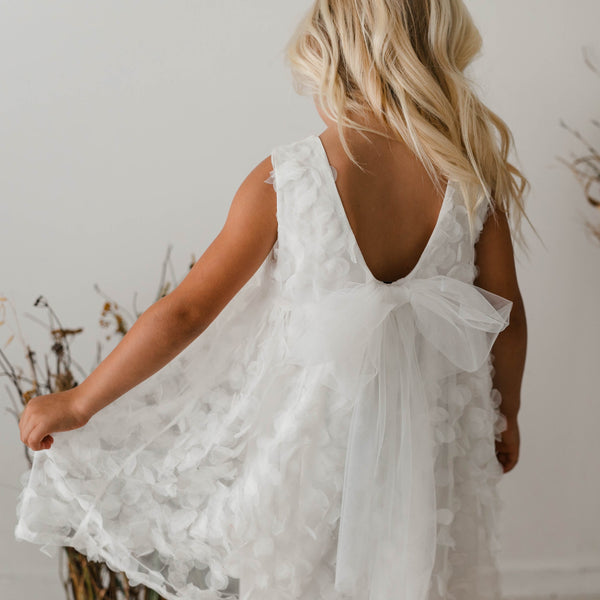 DRESS WITH PETALS AND BOW