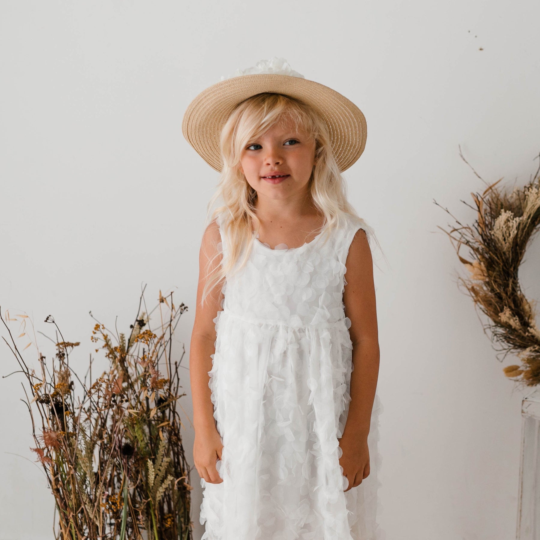 DRESS WITH PETALS AND BOW